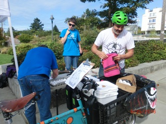 DRT riders load eggs at the Morgan Junction Hub, which simulated vials of medicine