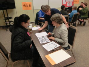 Part of the tabletop was to perform on the job training. Cheryl is training Melissa before a shift change.