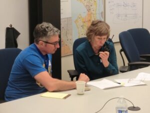 a man and a women send a radio message. There was great teamwork and support between the ACS people and the Hub people, for many it was their first time transmitting.