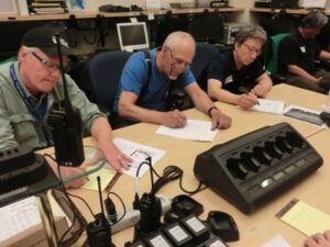 Stan, Ned, Claude and Ron show intense listening skills in the ACS radio room