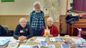 Volunteers ready for the crowd: Mel Fernandez, Susan Sanders, Vilma Fernandez